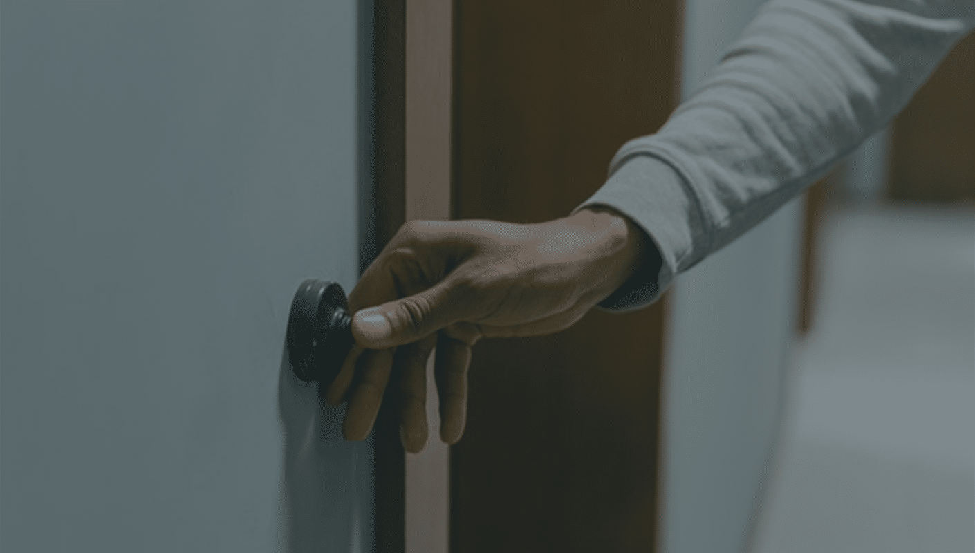 person ringing a doorbell