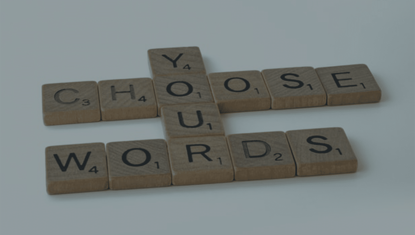 scrabble tiles that say "choose your words"